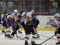 A hockey match between KS Cracovia 1906 (reds) and MMKS Podhale Nowy Targ (blues) takes place at the Adam 'Roch' Kowalski ice rink on the oc...