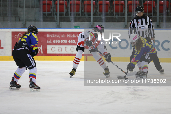 A hockey match between KS Cracovia 1906 (reds) and MMKS Podhale Nowy Targ (blues) takes place at the Adam 'Roch' Kowalski ice rink on the oc...