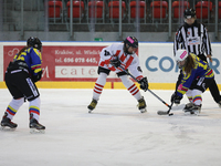 A hockey match between KS Cracovia 1906 (reds) and MMKS Podhale Nowy Targ (blues) takes place at the Adam 'Roch' Kowalski ice rink on the oc...