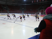 A hockey match between KS Cracovia 1906 (reds) and MMKS Podhale Nowy Targ (blues) takes place at the Adam 'Roch' Kowalski ice rink on the oc...