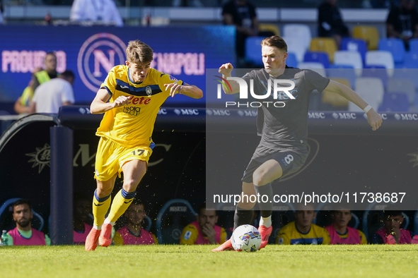 Charles De Ketelaere of Atalanta BC competes for the ball with Scott McTominay of SSC Napoli during the Serie A match between SSC Napoli and...