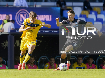 Charles De Ketelaere of Atalanta BC competes for the ball with Scott McTominay of SSC Napoli during the Serie A match between SSC Napoli and...