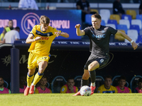 Charles De Ketelaere of Atalanta BC competes for the ball with Scott McTominay of SSC Napoli during the Serie A match between SSC Napoli and...