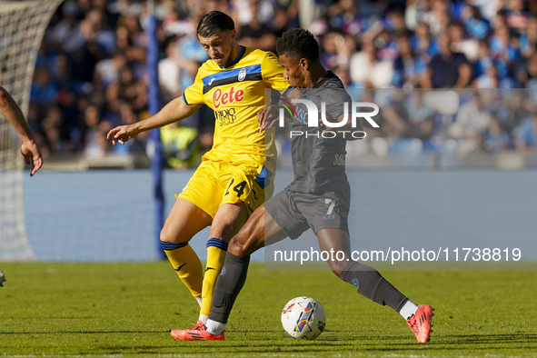 Lazar Samardzic of Atalanta BC competes for the ball with David Neres of SSC Napoli during the Serie A match between SSC Napoli and Atalanta...