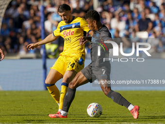 Lazar Samardzic of Atalanta BC competes for the ball with David Neres of SSC Napoli during the Serie A match between SSC Napoli and Atalanta...