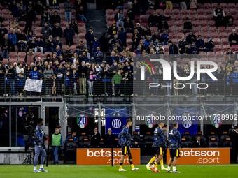 FC Internazionale supporters watch the warm-up during the Serie A match between FC Internazionale and Venezia FC at Giuseppe Meazza Stadium...