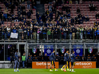 FC Internazionale supporters watch the warm-up during the Serie A match between FC Internazionale and Venezia FC at Giuseppe Meazza Stadium...