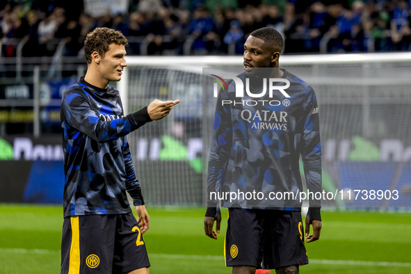 Benjamin Pavard and Marcus Thuram talk during the Serie A match between FC Internazionale and Venezia FC at Giuseppe Meazza Stadium in Milan...