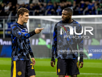 Benjamin Pavard and Marcus Thuram talk during the Serie A match between FC Internazionale and Venezia FC at Giuseppe Meazza Stadium in Milan...