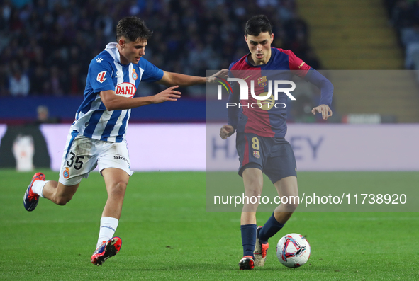 Pedri and Rafael Bauza play during the match between FC Barcelona and RCD Espanyol, corresponding to week 12 of LaLiga EA Sports, at the Llu...