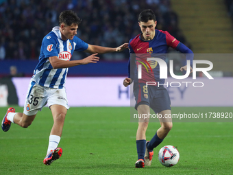 Pedri and Rafael Bauza play during the match between FC Barcelona and RCD Espanyol, corresponding to week 12 of LaLiga EA Sports, at the Llu...