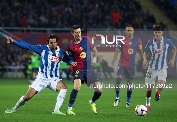 Robert Lewandowski and Leandro Cabrera play during the match between FC Barcelona and RCD Espanyol, corresponding to week 12 of LaLiga EA Sp...