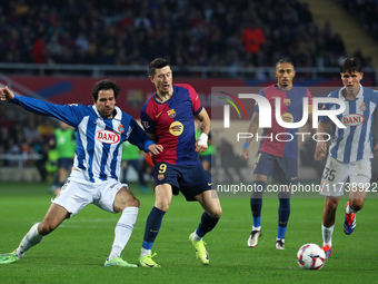 Robert Lewandowski and Leandro Cabrera play during the match between FC Barcelona and RCD Espanyol, corresponding to week 12 of LaLiga EA Sp...