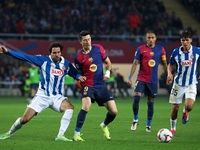 Robert Lewandowski and Leandro Cabrera play during the match between FC Barcelona and RCD Espanyol, corresponding to week 12 of LaLiga EA Sp...