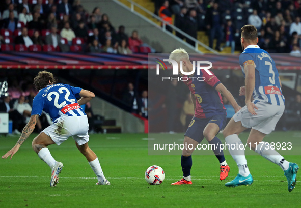 Dani Olmo, Carlos Romero, and Sergi Gomez play during the match between FC Barcelona and RCD Espanyol, corresponding to week 12 of LaLiga EA...