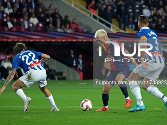 Dani Olmo, Carlos Romero, and Sergi Gomez play during the match between FC Barcelona and RCD Espanyol, corresponding to week 12 of LaLiga EA...