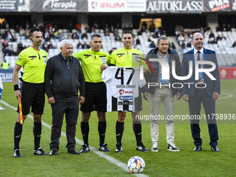 Referees officiate during the Supeliga match between Universitatea Cluj and Farul Constanta at Cluj Arena in Cluj, Romania, on November 3, 2...