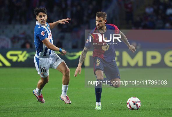 Inigo Martinez and Alvaro Aguado play during the match between FC Barcelona and RCD Espanyol, corresponding to week 12 of LaLiga EA Sports,...