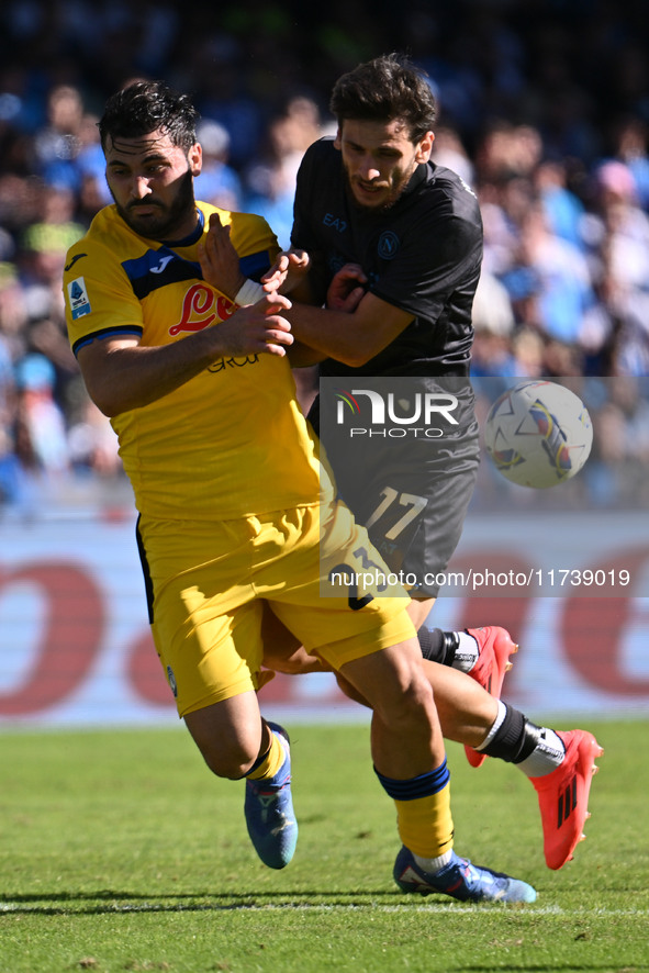 Sead Kolasinac of Atalanta B.C. and Khvicha Kvaratskhelia of S.S.C. Napoli are in action during the 11th day of the Serie A Championship bet...