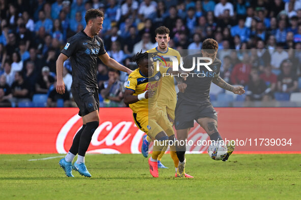 Amir Rrahmani of S.S.C. Napoli, Ademola Lookman of Atalanta B.C., and Giovanni Di Lorenzo of S.S.C. Napoli are in action during the 11th day...