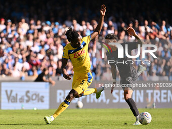 Odilon Kossounou of Atalanta B.C. and Mathias Olivera of S.S.C. Napoli are in action during the 11th day of the Serie A Championship between...