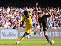 Odilon Kossounou of Atalanta B.C. and Mathias Olivera of S.S.C. Napoli are in action during the 11th day of the Serie A Championship between...