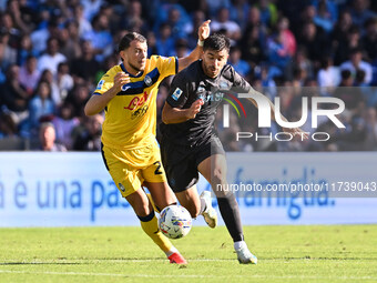 Lazar Samardzic of Atalanta B.C. and Giovanni Simeone of S.S.C. Napoli are in action during the 11th day of the Serie A Championship between...