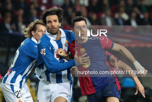 Robert Lewandowski and Leandro Cabrera play during the match between FC Barcelona and RCD Espanyol, corresponding to week 12 of LaLiga EA Sp...