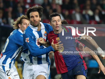 Robert Lewandowski and Leandro Cabrera play during the match between FC Barcelona and RCD Espanyol, corresponding to week 12 of LaLiga EA Sp...