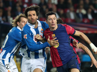 Robert Lewandowski and Leandro Cabrera play during the match between FC Barcelona and RCD Espanyol, corresponding to week 12 of LaLiga EA Sp...