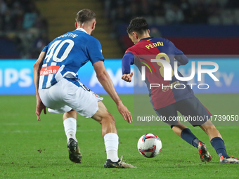 Pedri and Justin Smith play during the match between FC Barcelona and RCD Espanyol, corresponding to week 12 of LaLiga EA Sports, at the Llu...