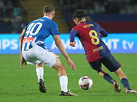 Pedri and Justin Smith play during the match between FC Barcelona and RCD Espanyol, corresponding to week 12 of LaLiga EA Sports, at the Llu...