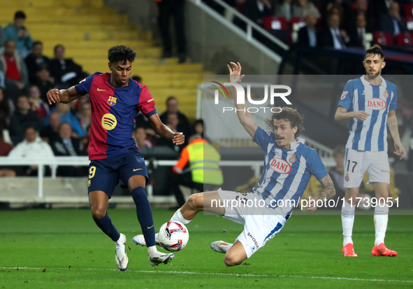 Lamine Yamal and Carlos Romero play during the match between FC Barcelona and RCD Espanyol, corresponding to week 12 of LaLiga EA Sports, at...