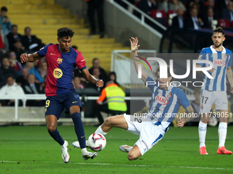 Lamine Yamal and Carlos Romero play during the match between FC Barcelona and RCD Espanyol, corresponding to week 12 of LaLiga EA Sports, at...