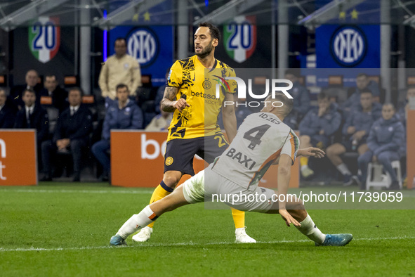 Hakan Calhanoglu plays during the Serie A match between FC Internazionale and Venezia FC at Giuseppe Meazza Stadium in Milano, Italy, on Nov...