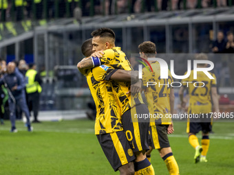 Marcus Thuram and Lautaro Martinez celebrate after scoring a goal during the Serie A football match between FC Internazionale and Venezia FC...