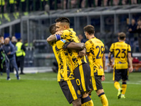 Marcus Thuram and Lautaro Martinez celebrate after scoring a goal during the Serie A football match between FC Internazionale and Venezia FC...