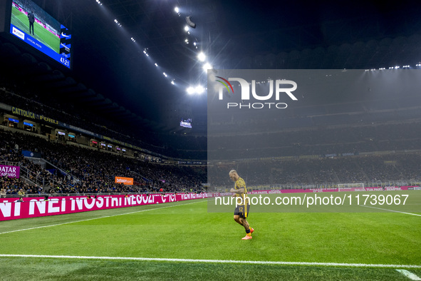 The action takes place during the Serie A match between FC Internazionale and Venezia FC at Giuseppe Meazza Stadium in Milano, Italy, on Nov...