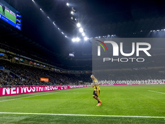 The action takes place during the Serie A match between FC Internazionale and Venezia FC at Giuseppe Meazza Stadium in Milano, Italy, on Nov...