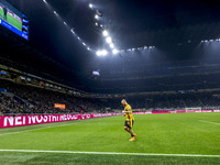 The action takes place during the Serie A match between FC Internazionale and Venezia FC at Giuseppe Meazza Stadium in Milano, Italy, on Nov...