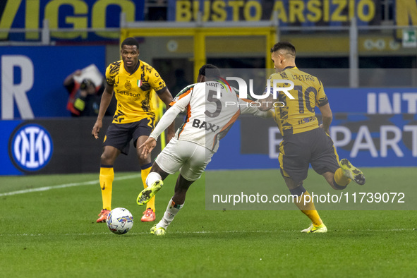 Ridgeciano Haps and Lautaro Martinez play during the Serie A match between FC Internazionale and Venezia FC at Giuseppe Meazza Stadium in Mi...