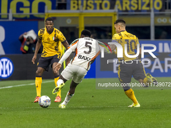 Ridgeciano Haps and Lautaro Martinez play during the Serie A match between FC Internazionale and Venezia FC at Giuseppe Meazza Stadium in Mi...