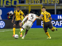 Ridgeciano Haps and Lautaro Martinez play during the Serie A match between FC Internazionale and Venezia FC at Giuseppe Meazza Stadium in Mi...