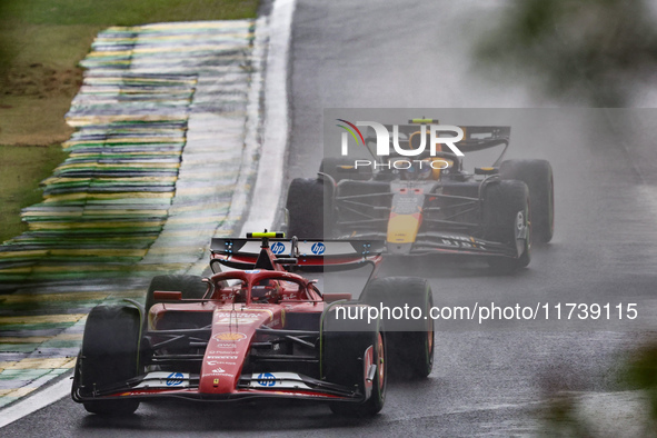 Charles Leclerc of Monaco drives the (16) Scuderia Ferrari SF-24 Ferrari, and Sergio Perez of Mexico drives the (11) Oracle Red Bull Racing...