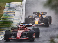 Charles Leclerc of Monaco drives the (16) Scuderia Ferrari SF-24 Ferrari, and Sergio Perez of Mexico drives the (11) Oracle Red Bull Racing...