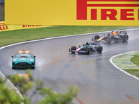 The safety car is in front of Esteban Ocon of France, who drives the (31) BWT Alpine F1 Team A524 Renault, and Max Verstappen of the Netherl...