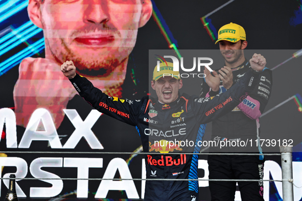 Max Verstappen of the Netherlands drives the Oracle Red Bull Racing RB20 Honda RBPT and wins the race on the podium during the Formula 1 Len...