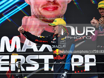 Max Verstappen of the Netherlands drives the Oracle Red Bull Racing RB20 Honda RBPT and wins the race on the podium during the Formula 1 Len...