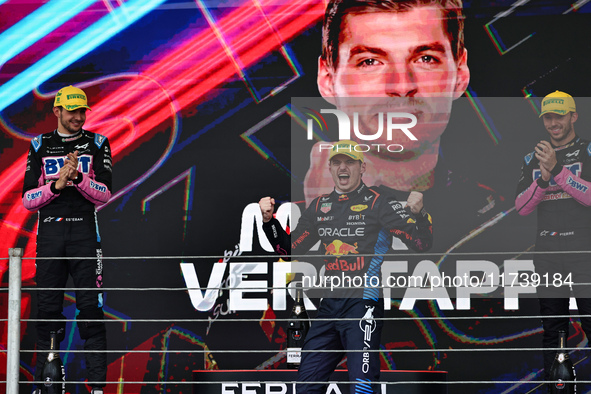 Max Verstappen of the Netherlands drives the Oracle Red Bull Racing RB20 Honda RBPT and wins the race on the podium during the Formula 1 Len...