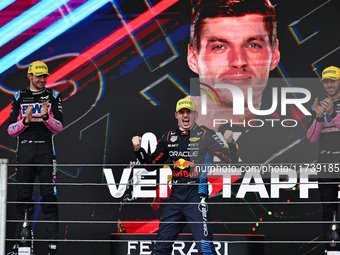 Max Verstappen of the Netherlands drives the Oracle Red Bull Racing RB20 Honda RBPT and wins the race on the podium during the Formula 1 Len...